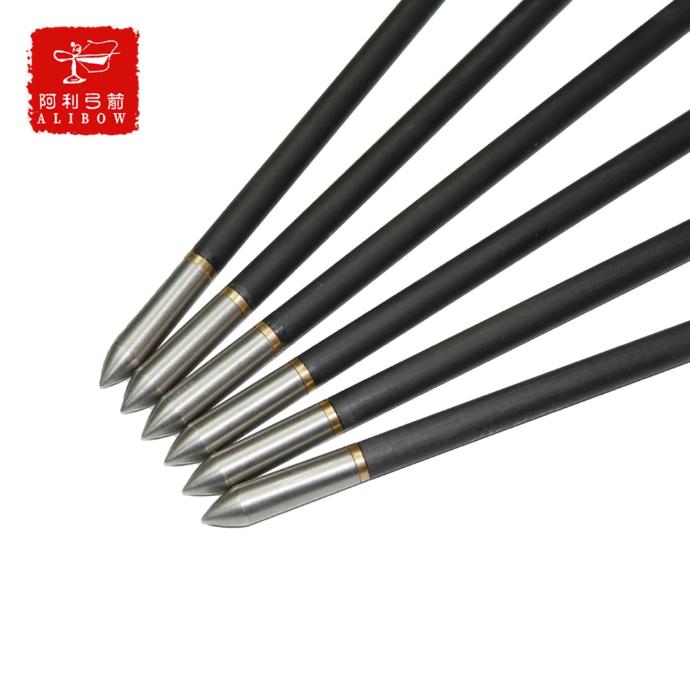 Six black-shafted Manchu arrows with steel field points, fanned out on a white background.
